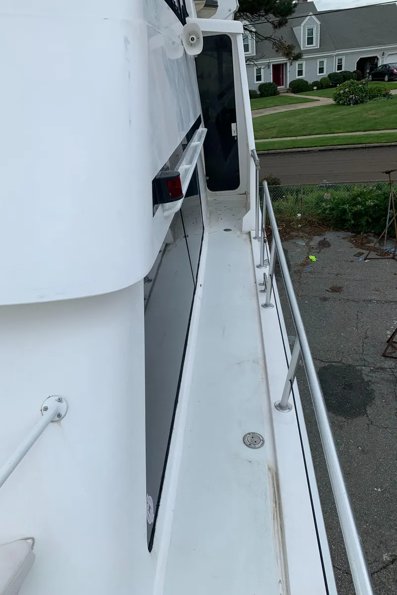 Slide: The Image of Side deck view of a 1998 Viking 60 CMY yacht. - 40