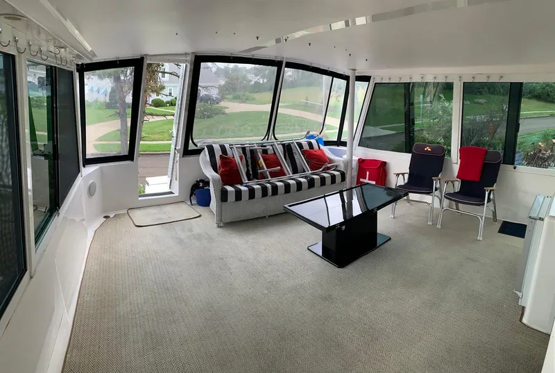 Slide: The Image of Spacious interior of 1998 Viking 60 CMY yacht with large windows and comfortable seating. - 41