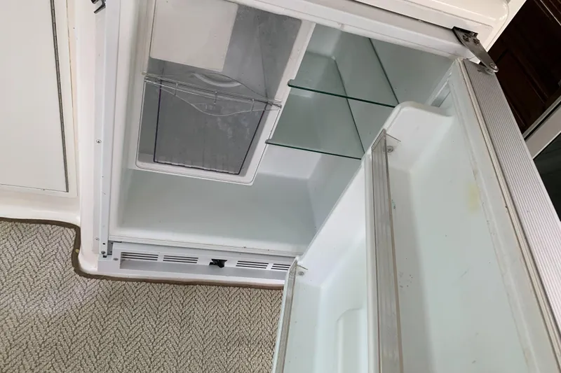 Slide: The Image of Open Viking 60 CMY refrigerator, 1998 model, showing empty shelves and door compartments. - 46