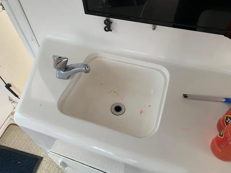 Slide: The Image of 1998 Viking 60 CMY boat sink with faucet and countertop. - 47