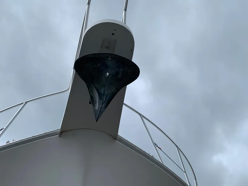 Slide: The Image of Anchor of 1998 Viking 60 CMY yacht against cloudy sky. - 6