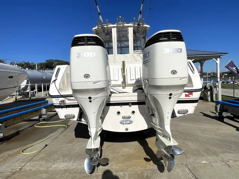 Slide: The Image of 2005 Pursuit 3070 Offshore boat with twin Suzuki 300 outboard engines. - 12