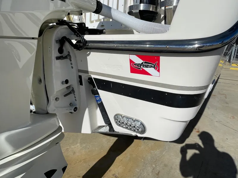 Slide: The Image of Close-up of a 2005 Pursuit 3070 Offshore boat's stern with a sticker. - 15