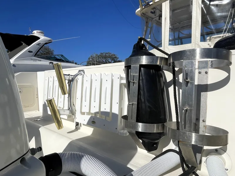 Slide: The Image of 2005 Pursuit 3070 Offshore boat deck with rod holders and equipment. - 16