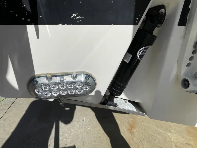 Slide: The Image of Close-up of 2005 Pursuit 3070 Offshore boat's hydraulic system and LED light. - 17