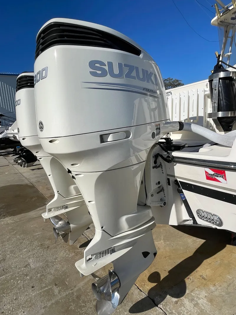 Slide: The Image of 2005 Pursuit 3070 Offshore boat with twin Suzuki outboard engines. - 19