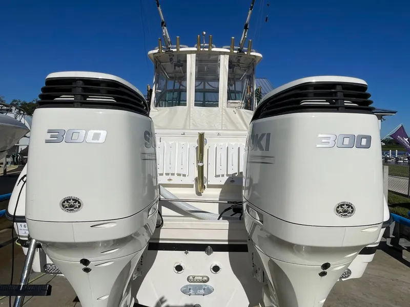 Slide: The Image of 2005 Pursuit 3070 Offshore boat with twin Suzuki 300 outboard engines. - 20