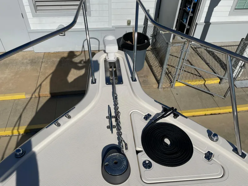 Slide: The Image of Bow of 2005 Pursuit 3070 Offshore boat with anchor and rope. - 27
