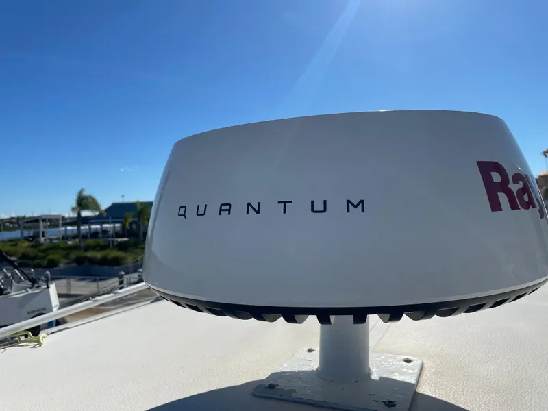 Slide: The Image of Radar system on a 2005 Pursuit 3070 Offshore boat under clear blue sky. - 31