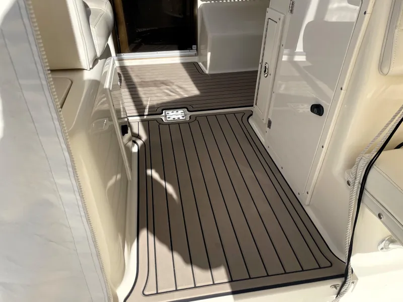 Slide: The Image of 2005 Pursuit 3070 Offshore boat interior with non-slip flooring. - 34