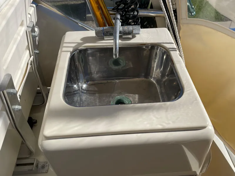 Slide: The Image of 2005 Pursuit 3070 Offshore boat sink with faucet. - 37