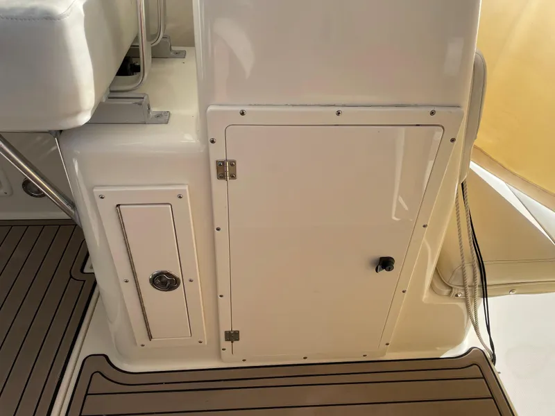 Slide: The Image of 2005 Pursuit 3070 Offshore boat interior storage compartments. - 38