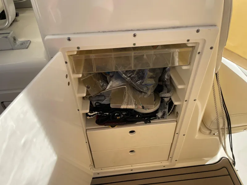 Slide: The Image of Storage compartment on a 2005 Pursuit 3070 Offshore boat. - 39