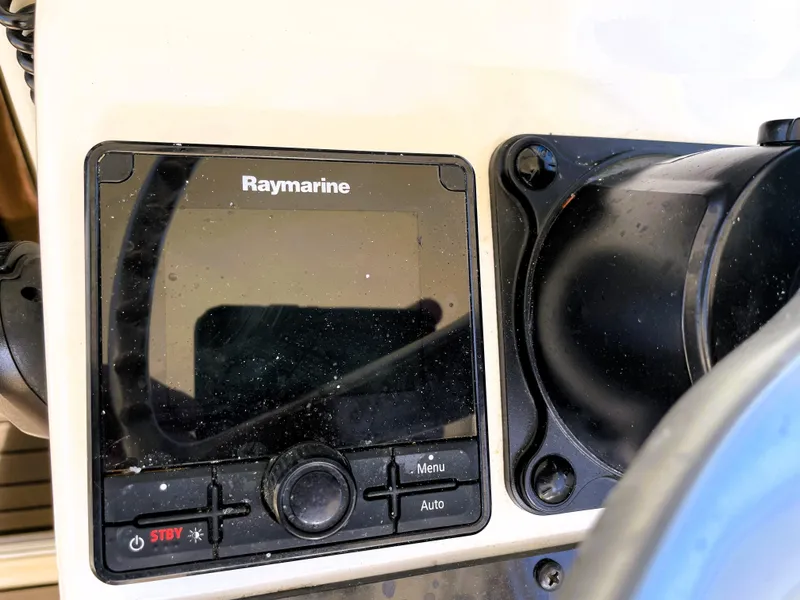 Slide: The Image of Raymarine display on 2005 Pursuit 3070 Offshore boat dashboard. - 43