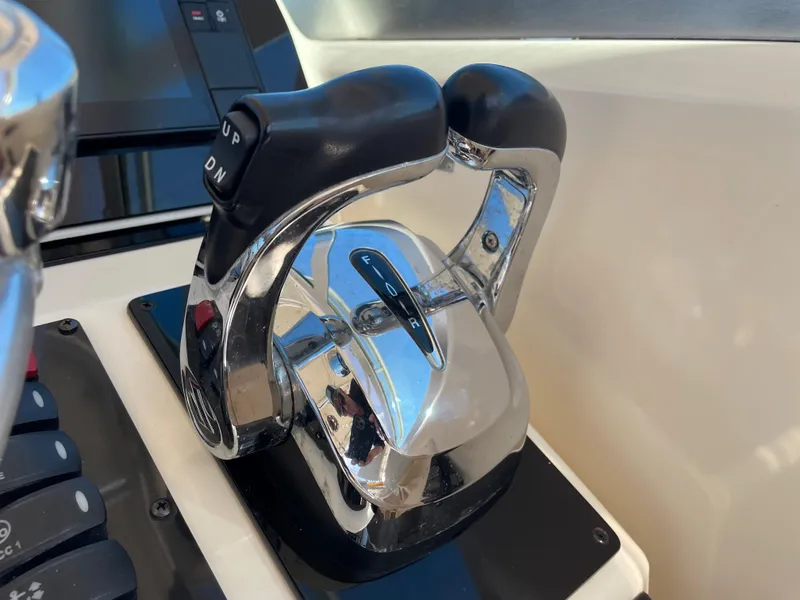 Slide: The Image of 2005 Pursuit 3070 Offshore boat throttle controls. - 44