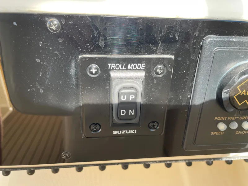 Slide: The Image of Suzuki troll mode switch on 2005 Pursuit 3070 Offshore boat. - 47
