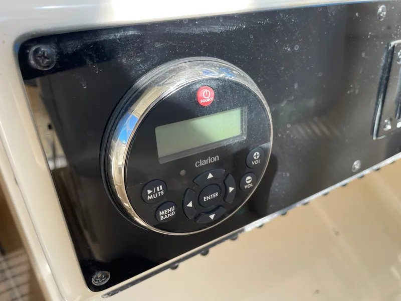 Slide: The Image of Close-up of Clarion audio control panel on 2005 Pursuit 3070 Offshore boat. - 48