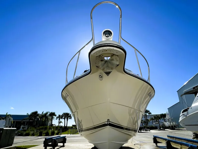 Slide: The Image of 2005 Pursuit 3070 Offshore boat on a sunny day. - 8