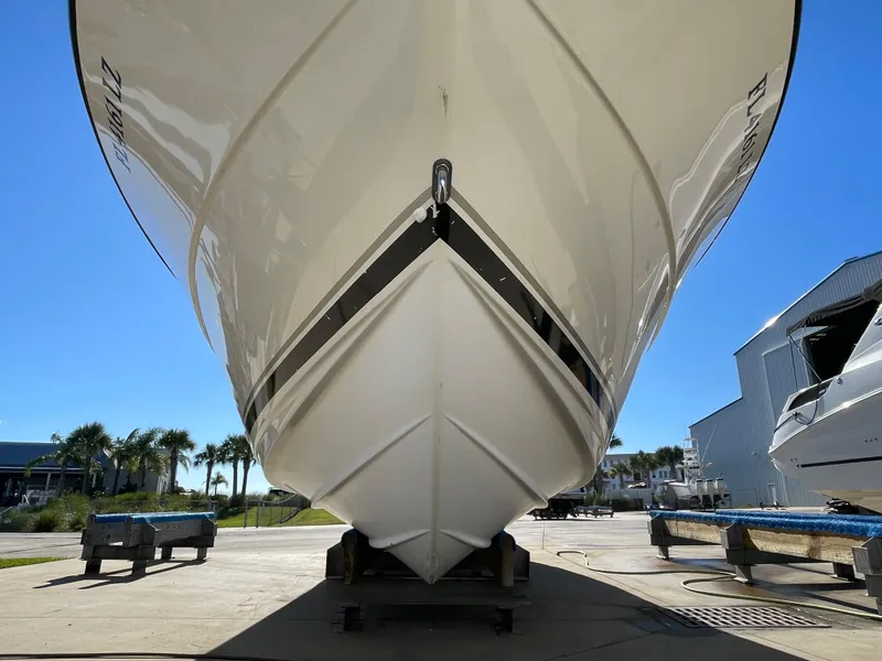 Slide: The Image of 2005 Pursuit 3070 Offshore boat on dry dock, front view. - 9