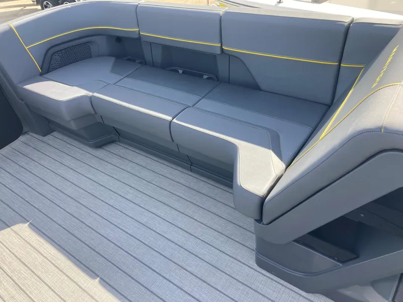 Slide: The Image of 2024 Manitou Explorer 24 Switchback 24 MAX Trifold Stealth boat seating area. - 11