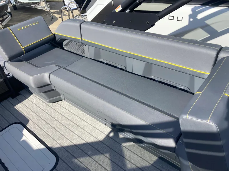 Slide: The Image of 2024 Manitou Explorer 24 Switchback 24 MAX Trifold Stealth boat seating. - 12