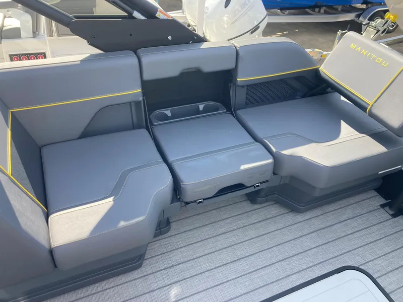 Slide: The Image of 2024 Manitou Explorer 24 Switchback 24 MAX Trifold Stealth boat seating area. - 14