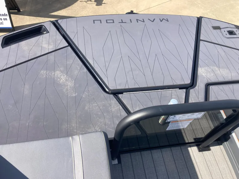 Slide: The Image of 2024 Manitou Explorer 24 Switchback MAX Trifold Stealth deck with sleek design. - 17
