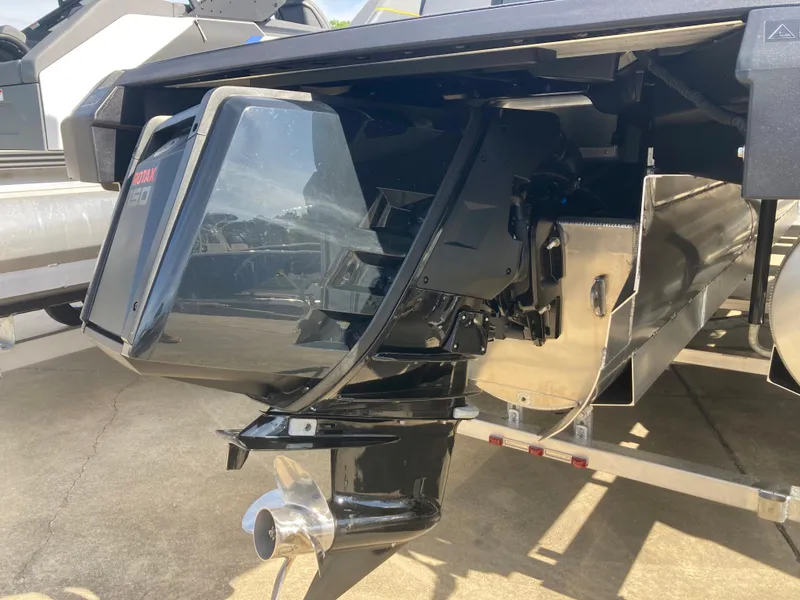 Slide: The Image of 2024 Manitou Explorer 24 Switchback 24 MAX Trifold Stealth outboard motor and propeller. - 5