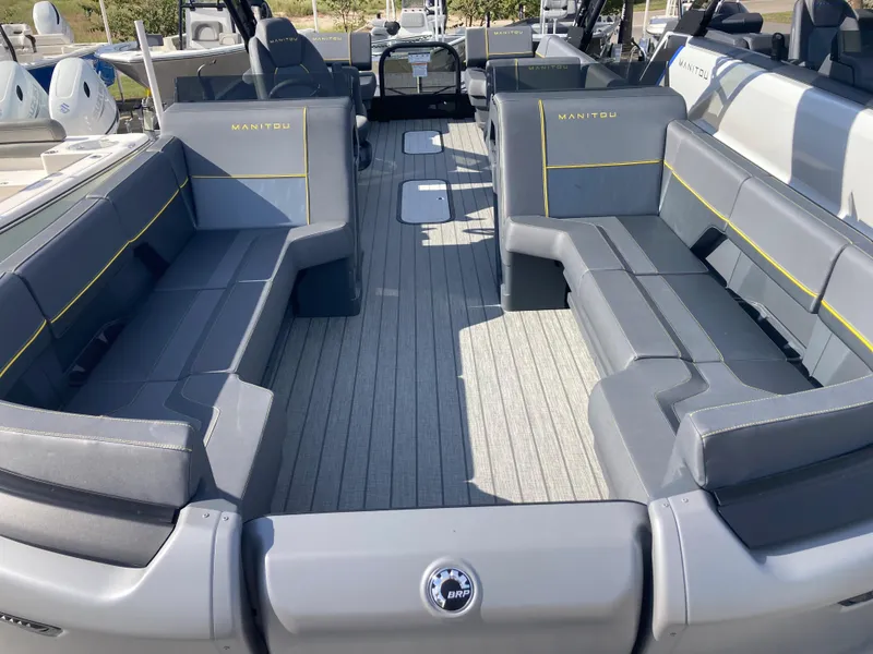 Slide: The Image of 2024 Manitou Explorer 24 Switchback 24 MAX Trifold Stealth interior with spacious seating. - 6