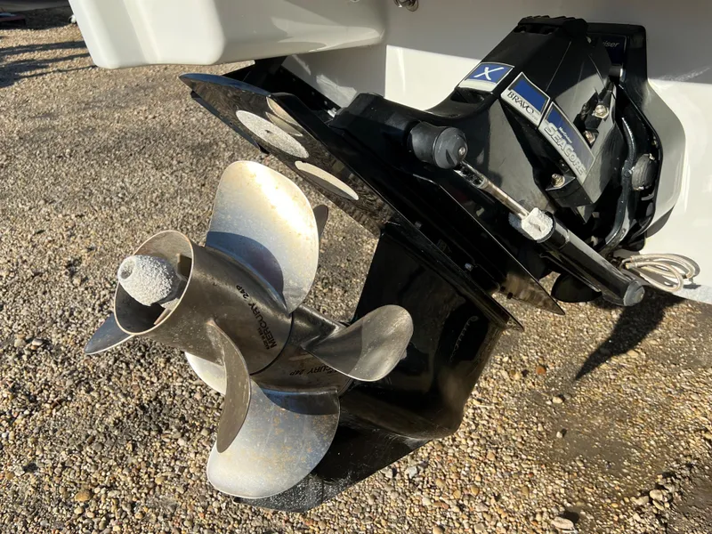 Slide: The Image of 2013 Formula 270 Bowrider propeller and outdrive on gravel surface. - 11