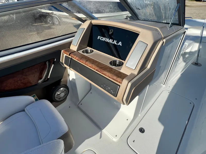 Slide: The Image of 2013 Formula 270 Bowrider dashboard with cup holders and steering wheel. - 22