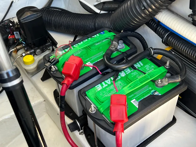 Slide: The Image of Dual batteries in a 2013 Formula 270 Bowrider boat engine compartment. - 25