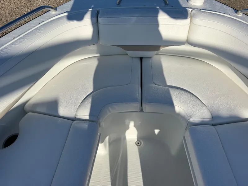 Slide: The Image of 2013 Formula 270 Bowrider boat with white cushioned seating area. - 36