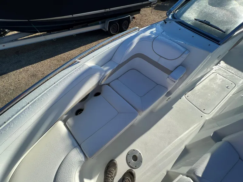 Slide: The Image of 2013 Formula 270 Bowrider boat interior with white seating and cup holders. - 38