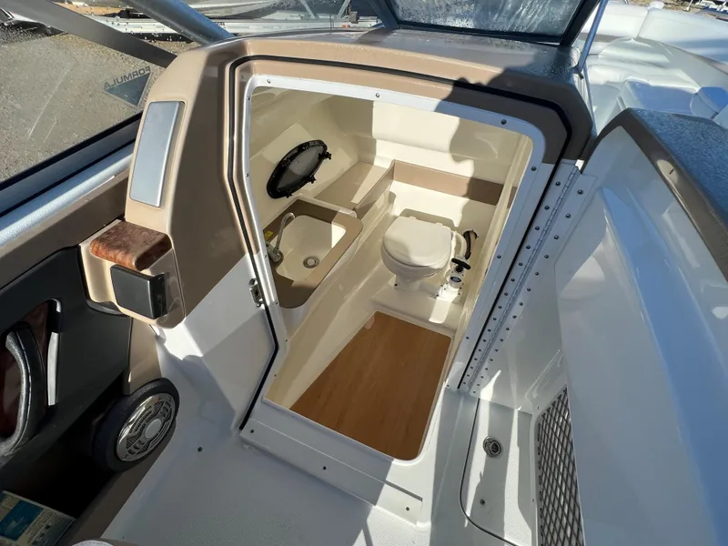 Slide: The Image of 2013 Formula 270 Bowrider boat interior with a compact bathroom. - 43