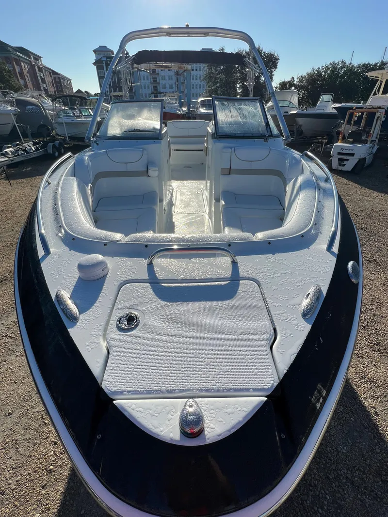 Slide: The Image of 2013 Formula 270 Bowrider boat with spacious seating and sleek design. - 46