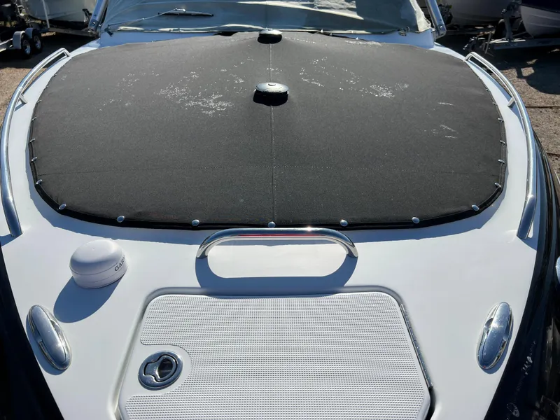 Slide: The Image of 2013 Formula 270 Bowrider boat with black cover and white deck. - 47