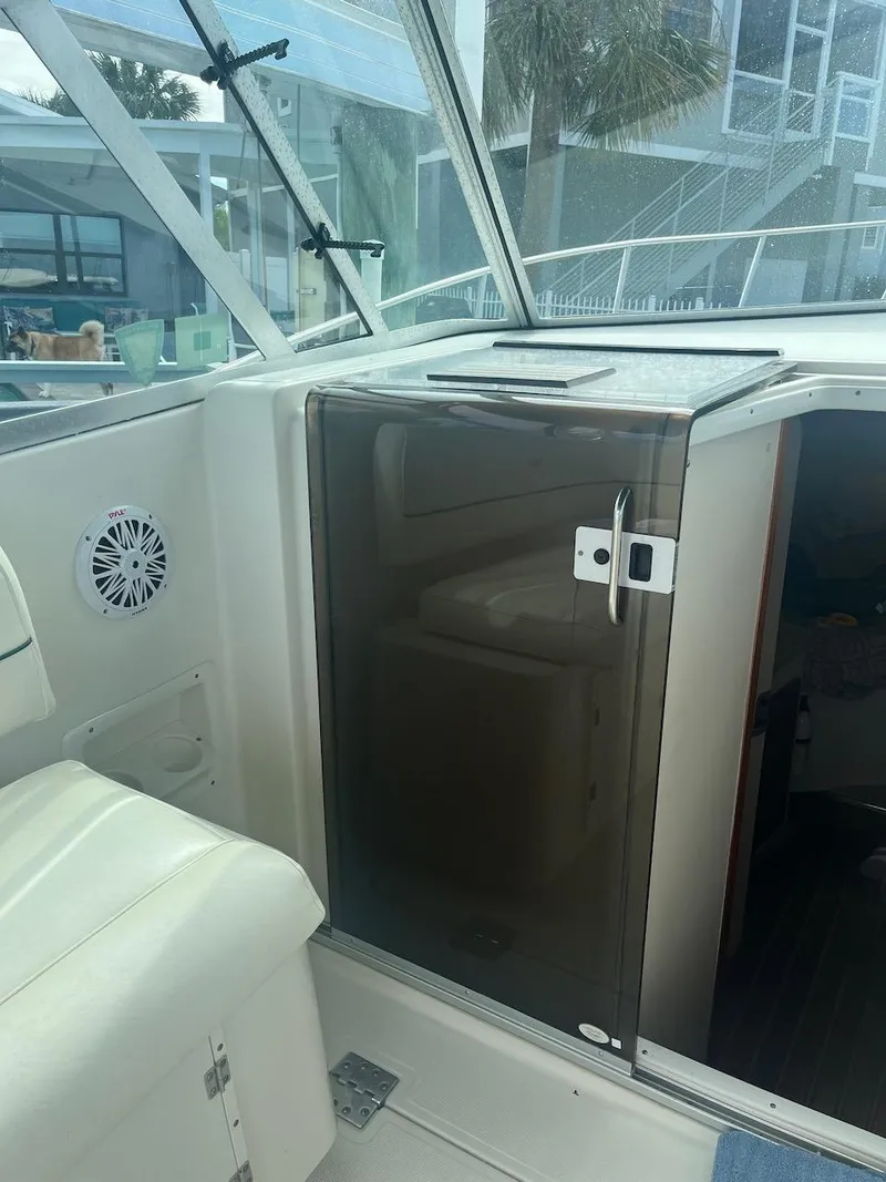 Slide: The Image of 2000 Pursuit 3000 Express boat interior with cabin door and seating. - 11