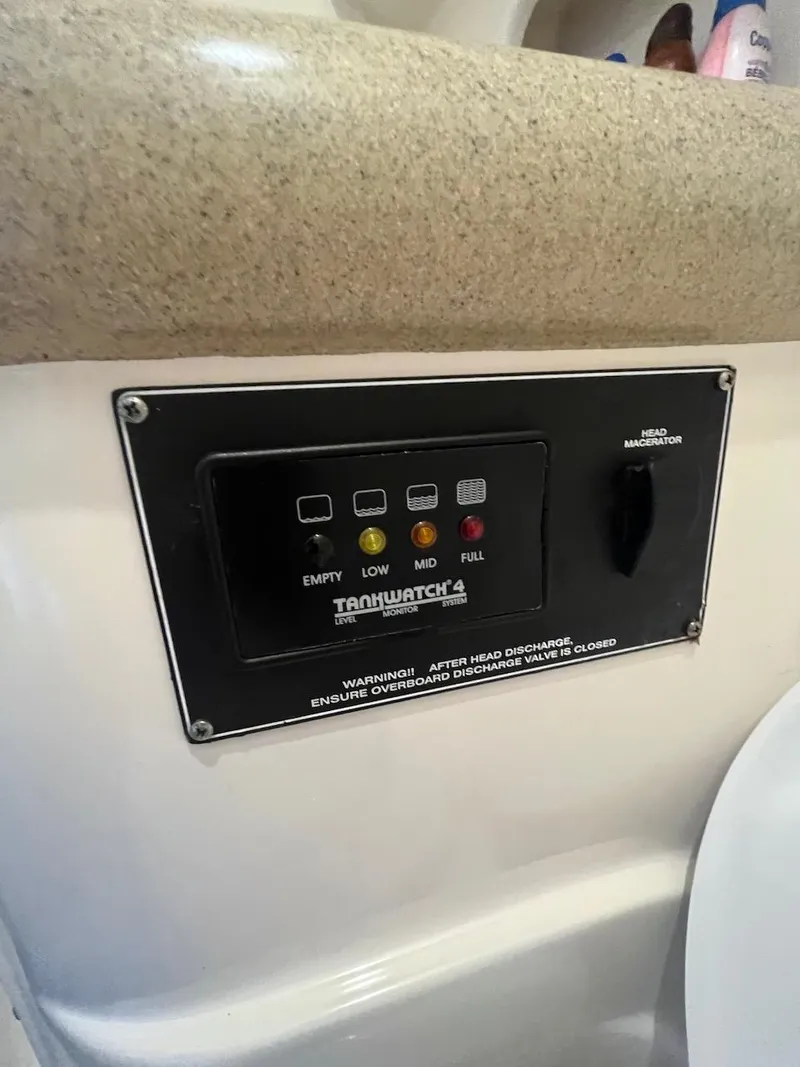 Slide: The Image of TankWatch 4 monitor panel on a 2000 Pursuit 3000 Express boat. - 24