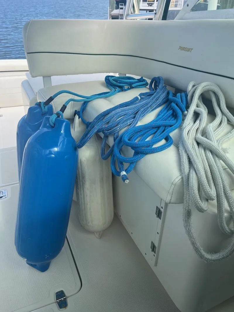 Slide: The Image of Boat interior with ropes and fenders on a 2000 Pursuit 3000 Express. - 26