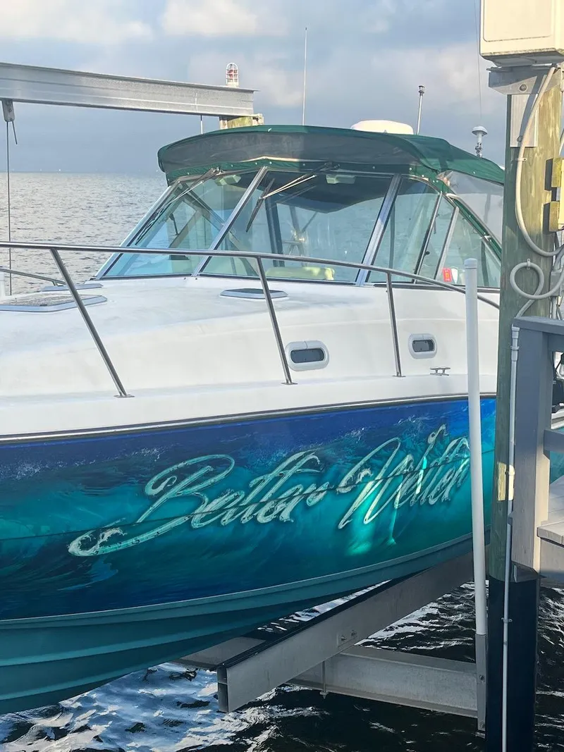 Slide: The Image of 2000 Pursuit 3000 Express boat docked, named Bella Vita. - 27