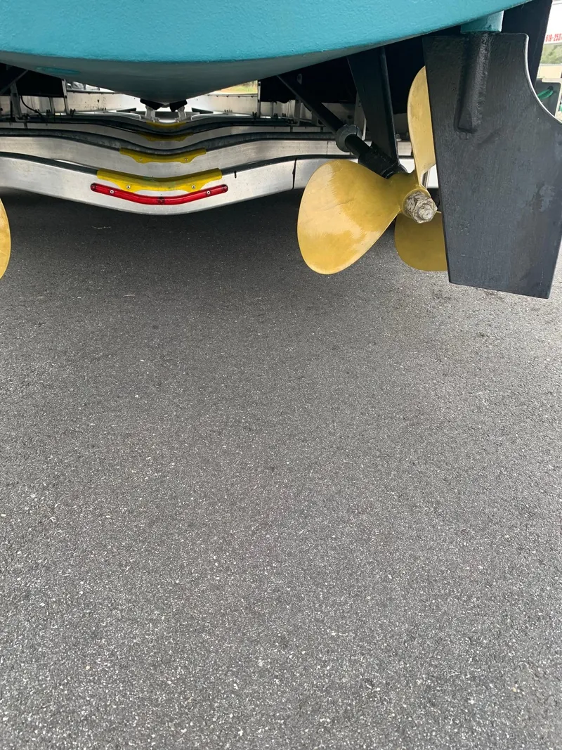 Slide: The Image of Alt text: 2000 Pursuit 3000 Express boat propellers and rudder on trailer. - 32