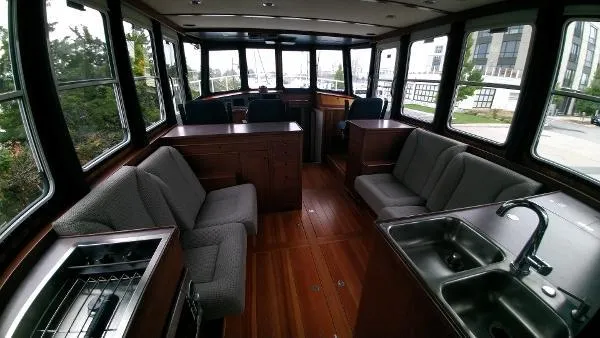 Slide: The Image of Interior of 2007 Custom Rockport Steel Trawler MY with wooden flooring and modern furnishings. - 22