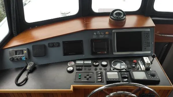 Slide: The Image of Control panel of 2007 Custom Rockport Steel Trawler MY with navigation and communication equipment. - 24