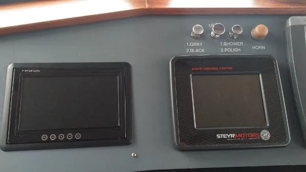 Slide: The Image of Control panel of a 2007 Custom Rockport Steel Trawler MY with Steyr Motors display. - 28