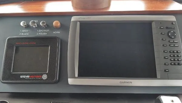 Slide: The Image of Control panel of a 2007 Custom Rockport Steel Trawler MY with Garmin display. - 29