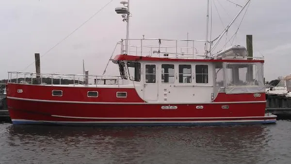 Slide: The Image of Red 2007 Custom Rockport Steel Trawler MY docked at marina. - 3