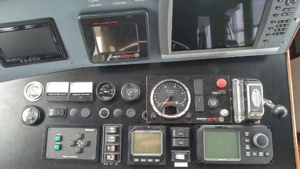 Slide: The Image of Control panel of a 2007 Custom Rockport Steel Trawler MY with various gauges and displays. - 30