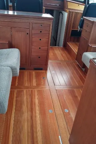 Slide: The Image of Interior of 2007 Custom Rockport Steel Trawler MY with wooden flooring and cabinetry. - 38