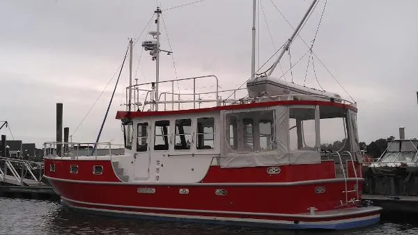 Slide: The Image of Red 2007 Custom Rockport Steel Trawler MY docked at marina. - 4